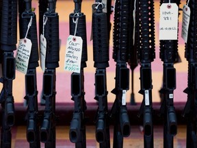 This file photo taken Nov. 5, 2016 shows rifles for sale at a gun shop in Merrimack, New Hampshire.