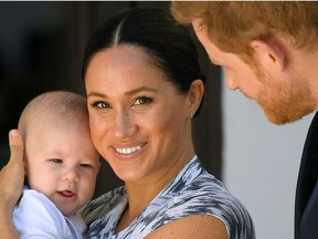 Britain's Prince Harry and his wife Meghan, Duchess of Sussex, holding their son Archie, September 25, 2019.