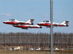 Canadian Forces Snowbirds aircraft take off an airport in Fort McMurray, Alta., in May.