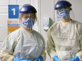 Dr. Jane Philpott (left) with a colleague at the Markham Stouffville Hospital's assessment centre.