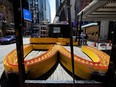 The letter M of a sign from a McDonald's restaurant on 42nd Street in Times Square in Manhattan is seen on a flatbed truck after it permanently closed June 24, 2020.