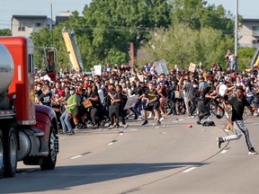 A tanker truck drives into thousands of protesters marching on 35W north bound highway during a protest against the death in Minneapolis police custody of George Floyd, in Minneapolis, Minnesota, U.S. May 31, 2020.