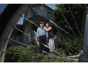 Don Crockford and Brenda MacKenzie in front of their house on Scott Street in Ottawa.
