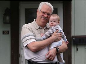 Robert Fairbairn and his seven-month old grandson, Lincoln.