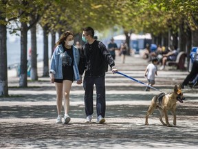 Serena and Felix take Tank for a walk along the Water's Edge Promenade near Sugar Beach in downtown Toronto on Sunday May 24, 2020.