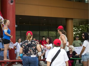 -- A group lead by Miranda Remillard gathered for the March To Unmask in Ottawa at city hall Sunday, July 19, 2020.