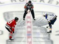 Jonathan Toews (left) of the Chicago Blackhawks and Brayden Schenn of the St. Louis Blues prepare to battle for the opening face-off in an exhibition game prior to the 2020 NHL Stanley Cup Playoffs at Rogers Place on Wednesday in Edmonton, Alberta.
