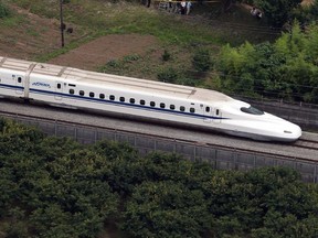 This aerial view shows a Nozomi 255 bullet train.