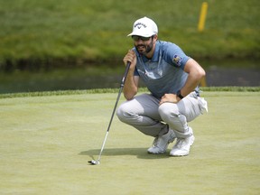 Canadian Adam Hadwin eyes his putt on the ninth hole during the first round of the Workday Charity Open golf tournament at Muirfield Village Golf Club.