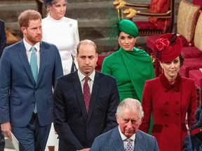 In this file photo taken on March 9, 2020 Prince Harry, Duke of Sussex (left) and Meghan, Duchess of Sussex (second from right) follow Prince William, Duke of Cambridge (centre) and Catherine, Duchess of Cambridge (right) as they depart Westminster Abbey after attending the annual Commonwealth Service in London.