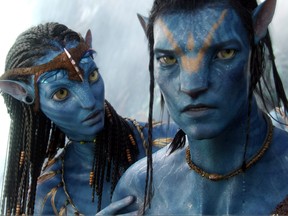 In this film publicity image released by 20th Century Fox, the character Neytiri, played by Zoe Saldana, left, and the character Jake, played by Sam Worthington are shown in a scene from, "Avatar."