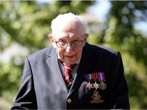 Retired British Army Captain Tom Moore, 99, raises money for health workers by attempting to walk the length of his garden one hundred times before his 100th birthday this month as the spread of coronavirus disease (COVID-19) continues, Marston Moretaine, Britain, April 15, 2020.