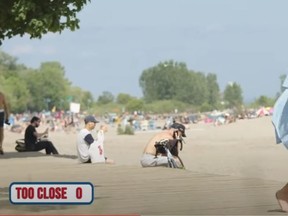 Mark Correia (a.k.a. Mark Clearview) pretends to pass out during a COVID-19 prank at Woodbine Beach