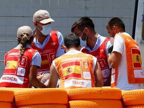 Marc Marquez is stretchered into an ambulance after crashing out during the MotoGP Spanish Grand Prix at Circuito de Jerez, in Jerez, Spain, Sunday, July 19, 2020.