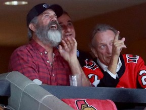 Movie star Mel Gibson (left) was in Ottawa Senators owner Eugene Melnyk's (right) box during a game against the Buffalo Sabres at the Canadian Tire Centre, in Kanata, Ont., on Feb 18, 2020.