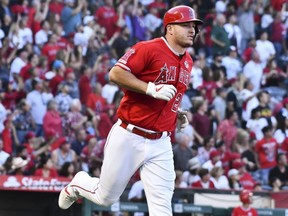 Angels centre fielder Mike Trout rounds the bases after hitting a two-run home run against the Mariners at Angel Stadium, in Anaheim, Calif., July 13, 2019.