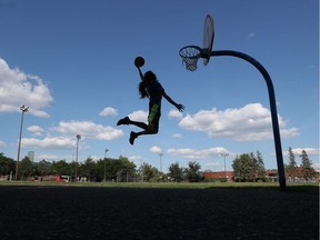 Daniel Baird plays some basketball at a Mechanicsville park in Ottawa on a hot Friday July 24, 2020.