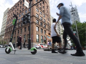 An e-scooter on a sidewalk in Old Montreal.