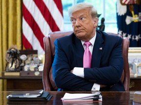 President Donald Trump talks to reporters while hosting Republican Congressional leaders and members of his cabinet in the Oval Office at the White House July 20, 2020 in Washington.