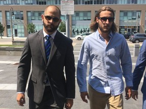 Toronto Police Const. Michael Theriault (left) and his brother Christian Theriault.