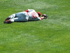 Jose Alvarez of the Philadelphia Phillies lays on the ground after being hit by a ball during the fifth inning of game one of a double-header against the Toronto Blue Jays at Sahlen Field on Aug. 20, 2020 in Buffalo, N.Y.