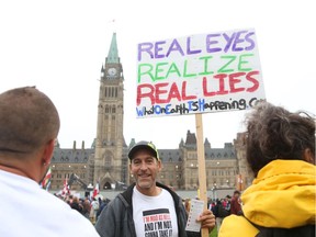 Vince Phillips attends an anti-mask protest on Parliament Hill on Saturday.