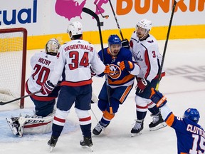 Washington Capitals goaltender Braden Holtby (70) reacts as New York Islanders center Jean-Gabriel Pageau (44) celebrates scoring a goal between Washington Capitals defenceman Jonas Siegenthaler (34) and defenceman Nick Jensen (3) in the first period in Game 4of the first round series. The way Pageau is playing, he looks like a Conn Smythe Trophy candidate.