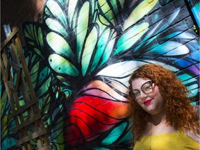 Veronica Roy, House of Paint's festival director, stands in front of a piece of street art in the Glebe Friday, August 7, 2020. House of Paint has launched a crowd-sourced map of murals and graffiti in Ottawa, so people can explore urban art.