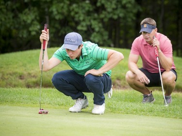 Joey Publow lines up a putt as Dave Petters looks on at the Ottawa Sun Scramble City Championship Week that wrapped up Sunday.