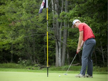 Ryan Baker takes a putt.