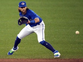 Toronto Blue Jays infielder Bo Bichette fields a ground ball during an intra-squad game in summer training at Rogers Centre.