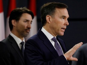 FILE PHOTO: Canada's Minister of Finance Bill Morneau attends a news conference with Prime Minister Justin Trudeau.