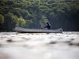 A canoeist enjoys some solitude on Meech Lake in Gatineau Park.