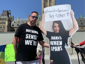 Marc Paquette of St-Eustache, Que., with a cutout of his wife, Melissa Contreras Cuspoca. They haven't seen each other since the beginning of March, and Paquette is considering moving to Colombia to be with her.