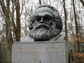 The bronze bust on top of the monument at the tomb of German revolutionary philosopher Karl Marx, a Grade I-listed monument, is seen in Highgate Cemetery in north London on February 5, 2019.