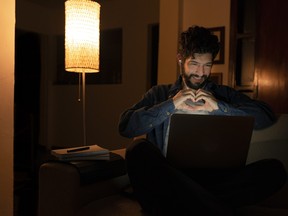 Chatting with his girlfriend via video call during social distance