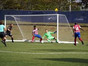 Atlético Ottawa goalkeeper Ignacio Zabal Almazán receives assistance from teammates as he defends against a Forge FC attack during Sunday's game in Charlottetown.