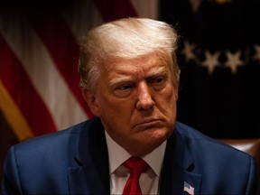 President Donald Trump listens during a meeting with members of the National Association of Police Organizations Leadership in the Cabinet Room of the White House July 31, 2020 in Washington.