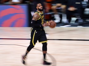 LeBron James of the Los Angeles Lakers dribbles the ball during the fourth quarter against the Houston Rockets in Game 2 of the Western Conference Second Round during the 2020 NBA Playoffs at AdventHealth Arena at the ESPN Wide World Of Sports Complex on Sept. 6, 2020 in Lake Buena Vista, Fla.