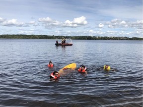 Firefighters rescued a kayaker who capsized and was swept through Remic Rapids on the Ottawa River on Sunday afternoon.