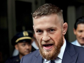 Conor McGregor talking to the press after he pleaded guilty to a single violation of disorderly conduct, in Brooklyn Criminal Court in 2018.