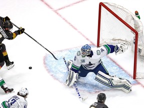 Vancouver Canucks goalie Thatcher Demko makes a save against the Vegas Golden Knights during Game 5 of the Western Conference series on Tuesday. Demko made 42 saves in a gutsy 2-1 victory to become the first goalie to win his playoff debut in an elimination game since Jose Theodore, with the 1997 Canadiens.