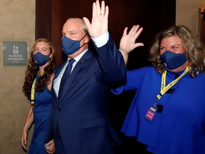 Erin O'Toole walks with his family, wife Rebecca, daughter Mollie, to give his victory speech as the new leader of Canada's main opposition Conservative Party in Ottawa, Aug. 24, 2020.