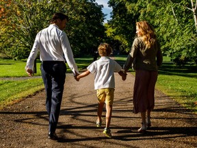 Prime Minister Justin Trudeau and his wife, Sophie Grégoire Trudeau, walk with their son, Hadrien, on his first day of Grade 1 in Ottawa on Thursday.