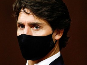 Canada's Prime Minister Justin Trudeau listens to Governor General Julie Payette deliver the Throne Speech in the Senate, as parliament prepares to resume in Ottawa, Ontario, Canada September 23, 2020.