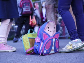 A school bag and a lunch bag are seen in the school yard at the Bancroft Elementary School as students go back to school in Montreal, on Monday, August 31, 2020.