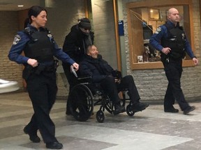 Francois Lamarre, a retired Montreal police and former minor league hockey coach in Greenfield Park, Que., appears for his arraignment at the courthouse in Longueuil, Que., on December 19, 2019 on various alleged sex crimes involving minors.