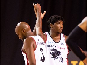 Johnny Berhanemeskel (3) high-fives Shaquille Keith (13) after the Ottawa BlackJacks defeated the Fraser Valley Bandits 78-76 during a Canadian Elite Basketball League Summer Series game at St. Catharines on Thursday, July 30, 2020.