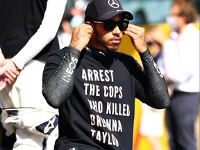 Lewis Hamilton takes a knee on the grid in support of ending racism before the F1 Grand Prix of Tuscany at Mugello Circuit on September 13, 2020 in Scarperia, Italy.