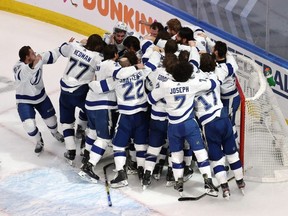 The Lightning celebrate following the series-winning 2-0 victory over the Stars in Game 6 of the 2020 NHL Stanley Cup Final at Rogers Place in Edmonton, Monday, Sept. 28, 2020.